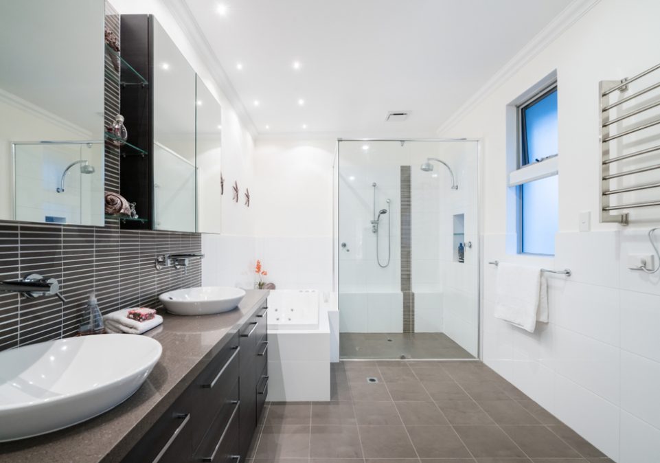 Large modern bathroom interior with floor to ceiling tiling and luxury fittings — Home Builders in Burleigh, QLD