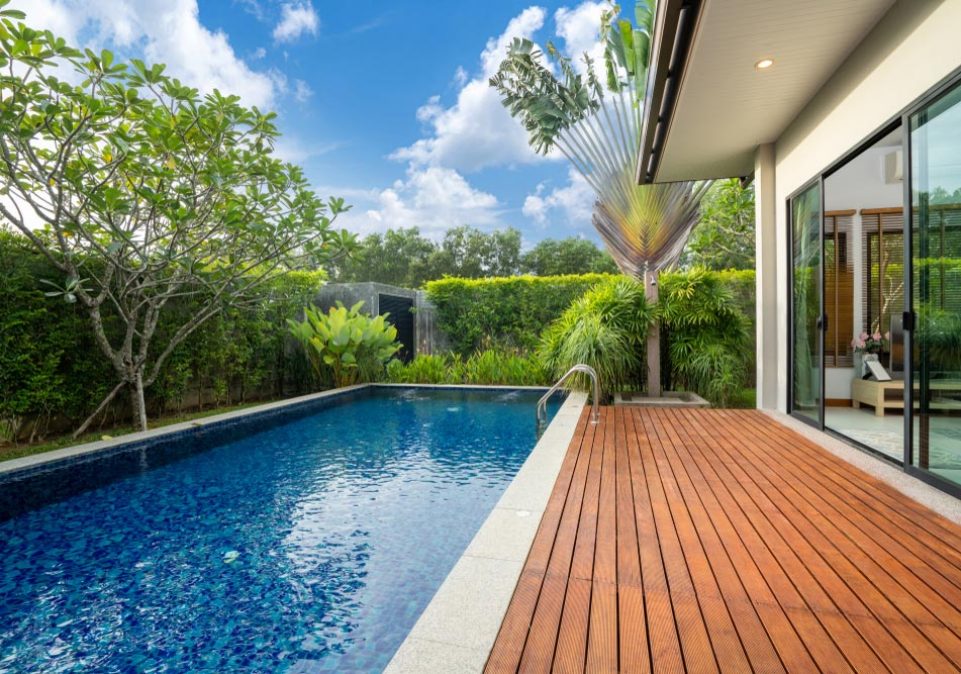 Swimming pool and decking in garden — Home Builders in Burleigh, QLD